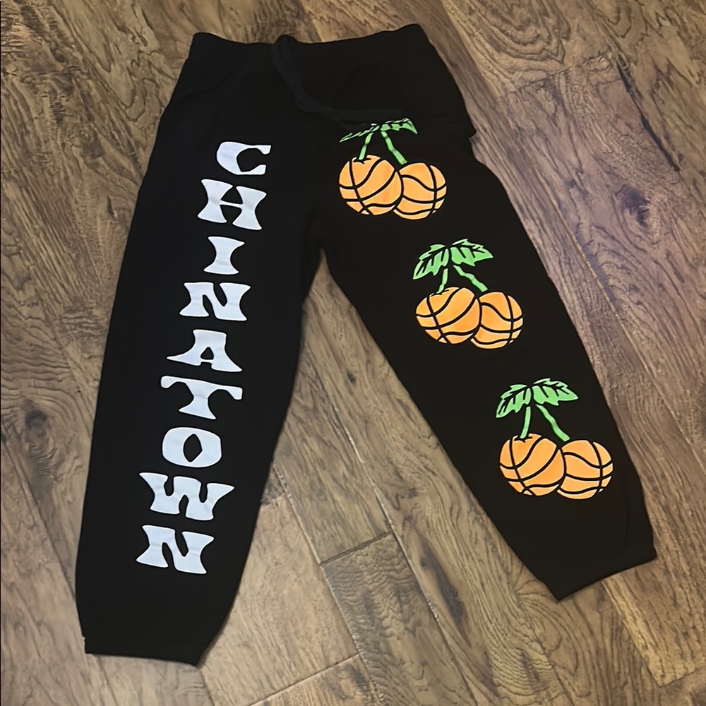 Chinatown Market Black Sweatpants with Basketball Graphics